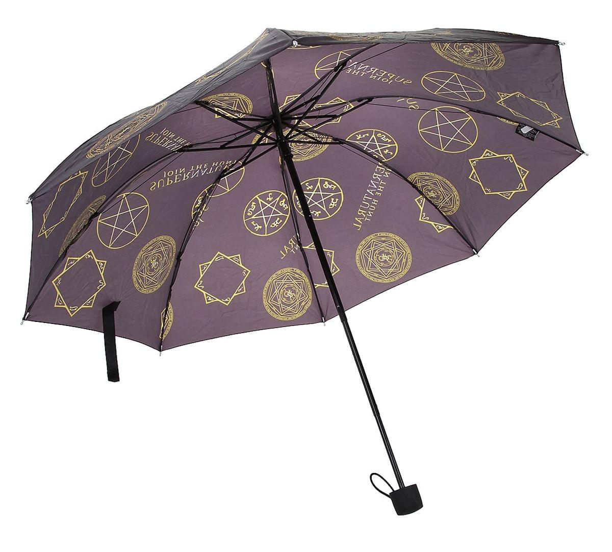 A purple umbrella covered in symbols from the TV series Supernatural.