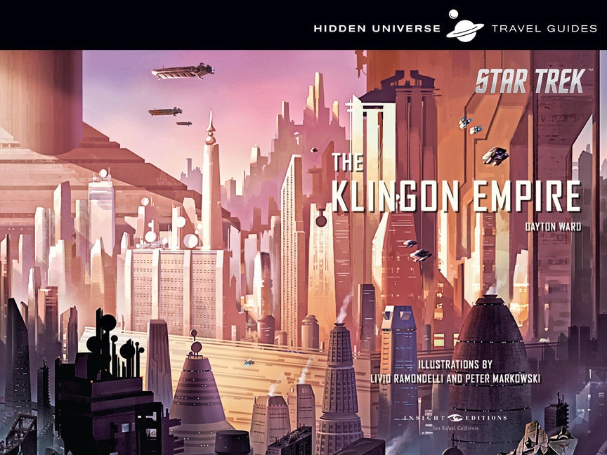 A two-page spread from the guide book. A futuristic alien city sprawls across the pages. At the top is a black banner with white text white text saying "hidden Universe Travel Guides," and a drawing of the planet Saturn sits in the center. At the bottom right corner is white text saying "Star Trek: The Klingon Empire."