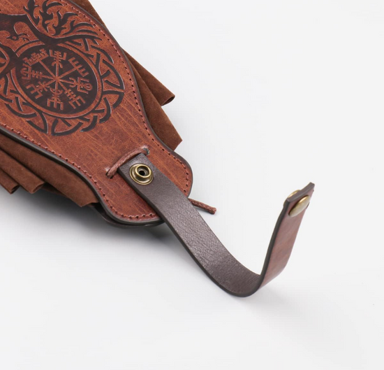 Close up of a brown faux leather pouch on a white background. The front of the bag has a Norse compass etched in black, with a phoenix at the bottom. At the top is an unfastened leather clasp.