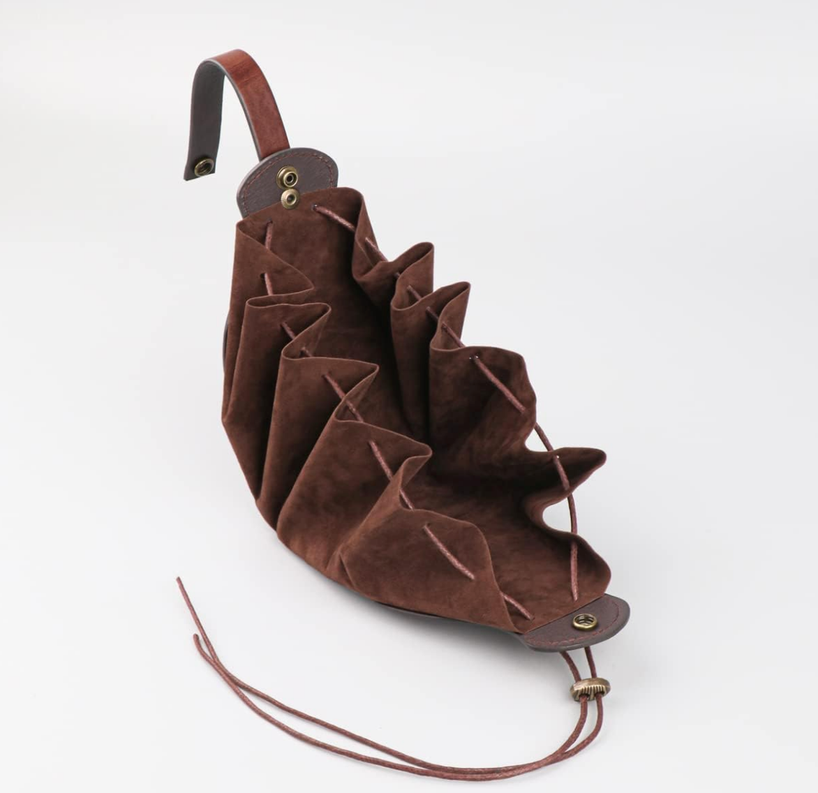 Top view of a brown leather pouch on a white background, opened to show the empty storage space inside.