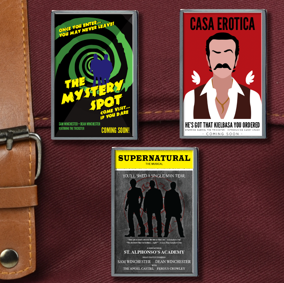 Three enamel pins on a maroon canvas bag. The top left pin depicts a green and black swirl, with "Mystery Spot" in yellow letters. The top right depicts a mustached man in a white shirt against a red background. Black text says "casa erotica." The bottom pin has Dean, Sam, and Castiel in silhouette against a grey background. At the top is a yell banner with black text saying "Supernatural the musical."