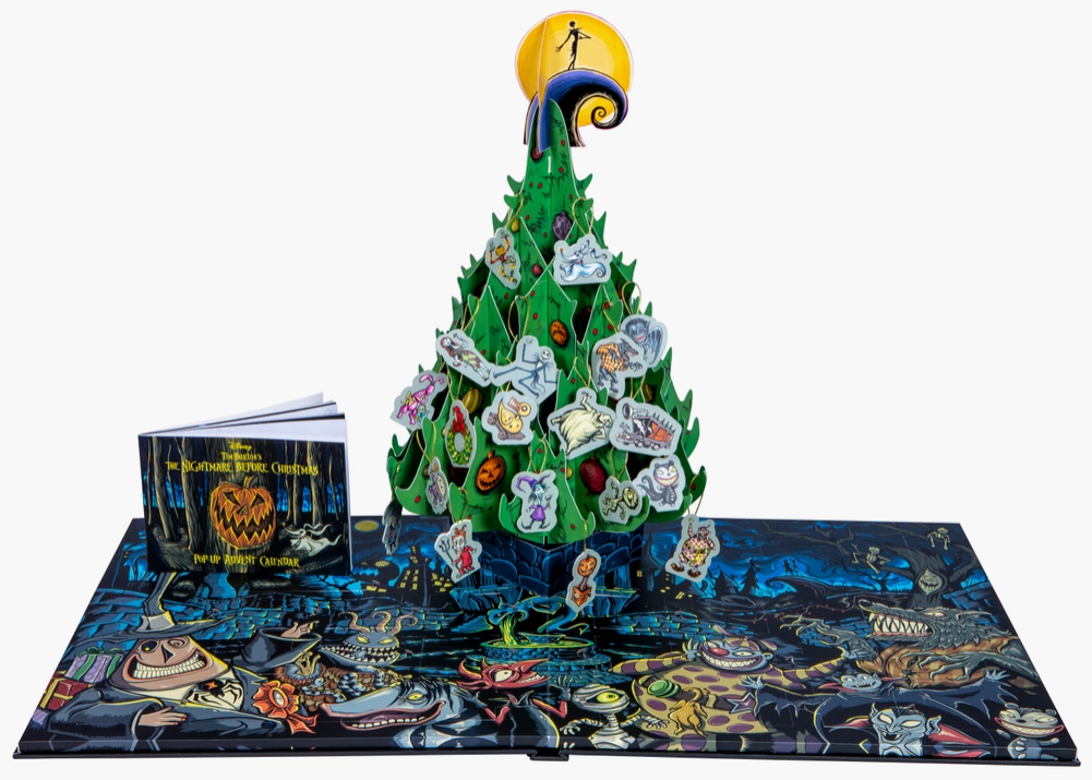 A pop-up page of the advent calendar, showing a paper Christmas tree decorated with Halloween Town characters.