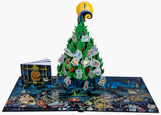 A pop-up page of the advent calendar, showing a paper Christmas tree decorated with Halloween Town characters.