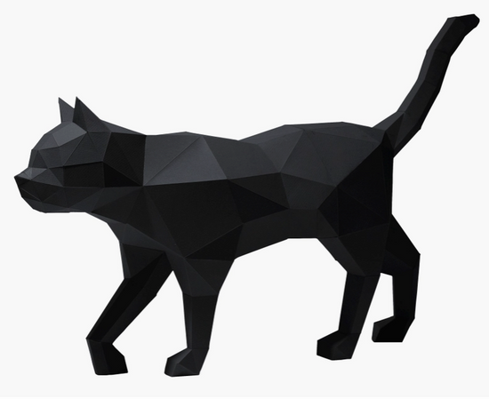 Left-side view of a paper model of a black cat on a white background.