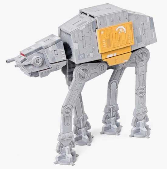 A top view of the grey AT-AT Walker model, with one section colored light orange.