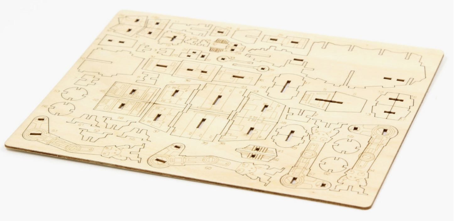 Load image into Gallery viewer, A flat wooden sheet off of the model parts, to be punched out and assembled.

