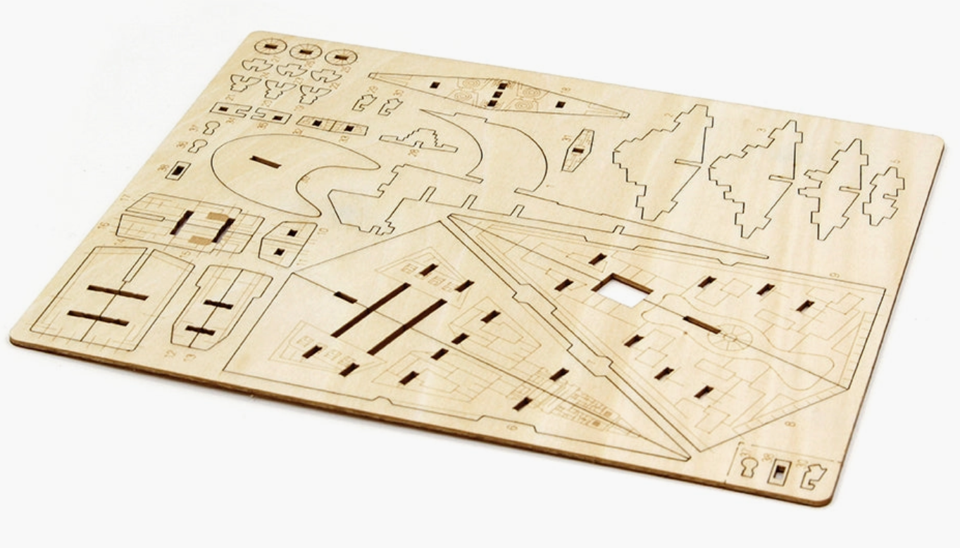 A flat wooden sheet of of the model parts, to be punched out and assembled.