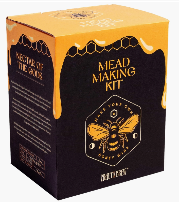 A black and yellow square box on a white background. The top of the box depicts honey running down the sides. On the top of the box in yellow text is "mead making kit," with a drawing of a honeybee under it.
