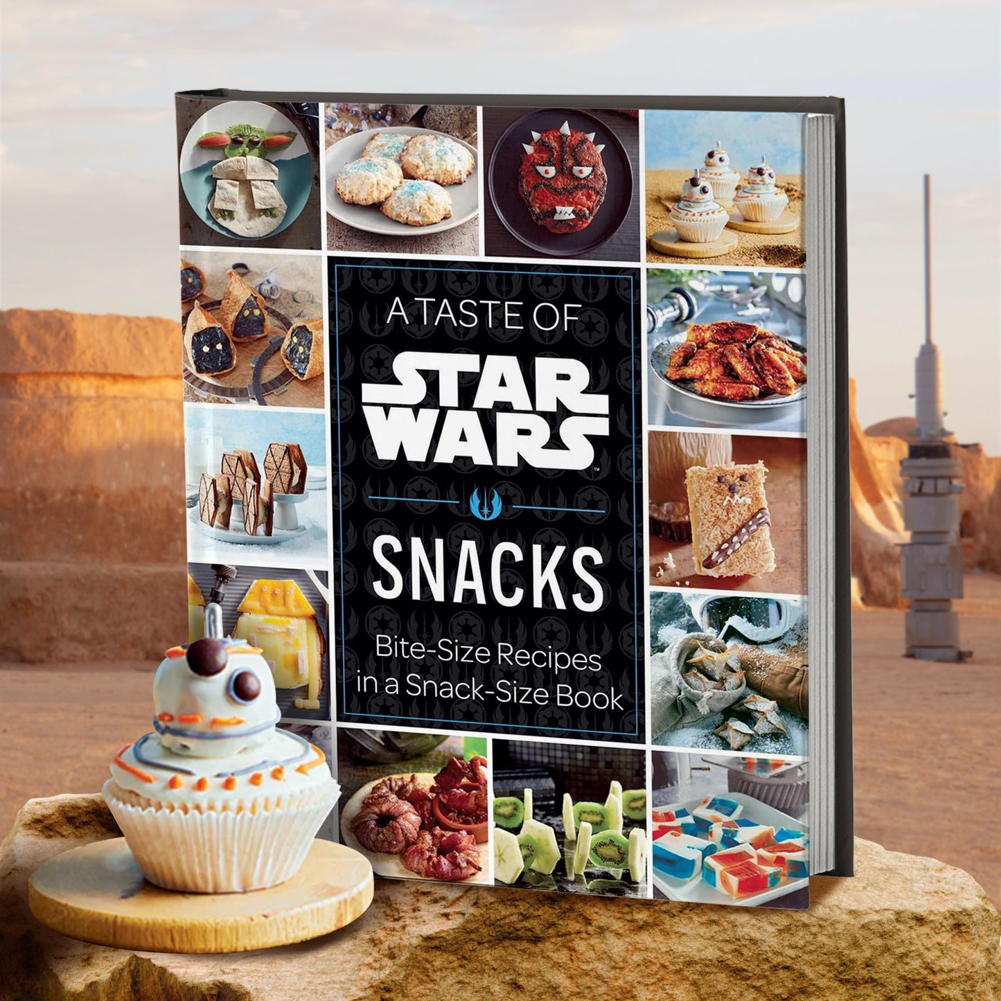 A hardcover book standing on a sand-colored rock in the desert. Around the edges are images of various Star Wars themed foods. In the center is a black rectangle, with white text that says "A taste of Star Wars. Snacks." In front of the book is a cupcake shaped like the droid BB8 from Star Wars. Behind the book is the Tatooine desert. with a moisture vaporator visible in the distance.