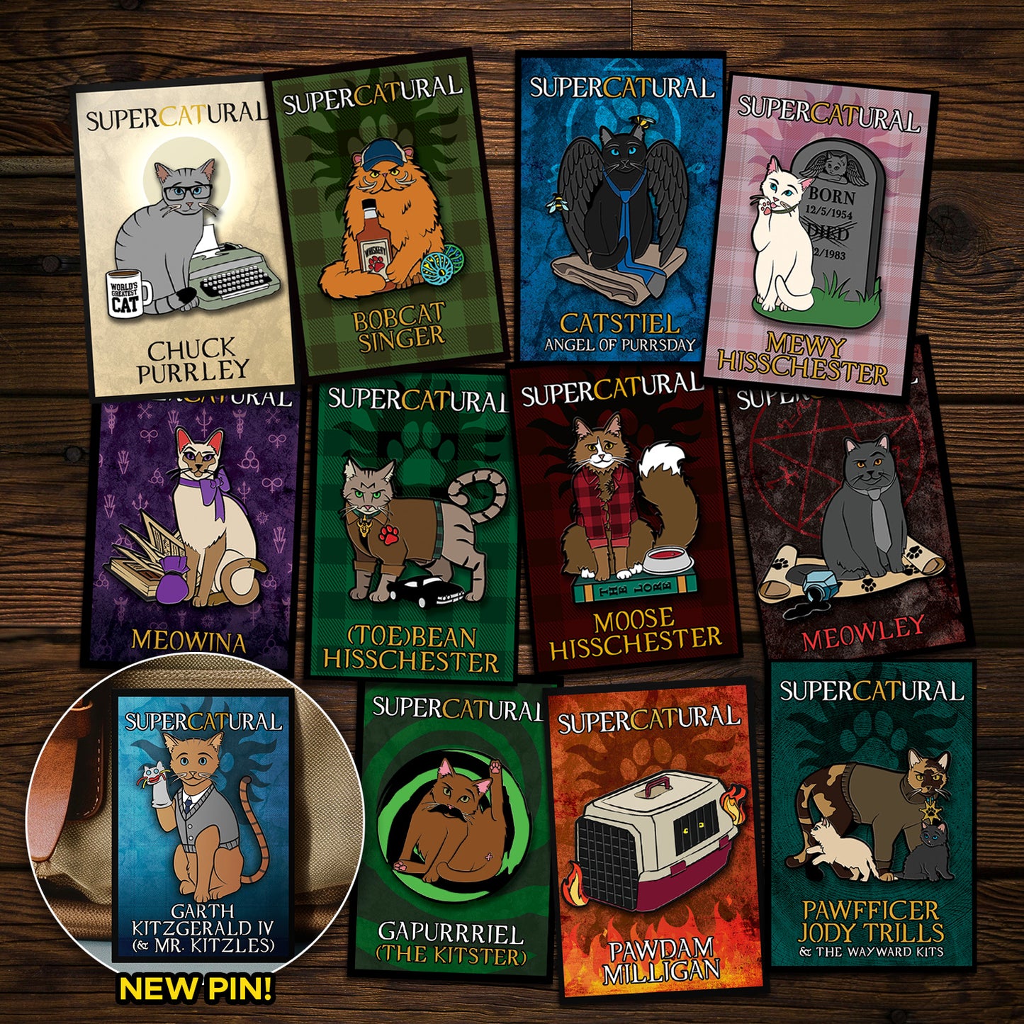 A collection of enamel pins on a wooden table. Each pin depicts a character from the TV series "Supernatural" reimagined as cats. An inset in the bottom left corner reads "NEW PIN!" and has an image of Garth Kitzgerald IV, the newest pin.