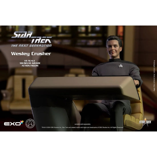 An action figure depicting the character Wesley Crusher from the TV series "Star Trek: The Next Generation." The figuring is dressed in Wesley's iconic grey uniform. Silver and white text at the top says "Star Trek the never generation, Wesley Crusher. One sixth scale museum grade action figure." The figure is seated at the helm of the Enterprise, with the starship's bridge in the background.