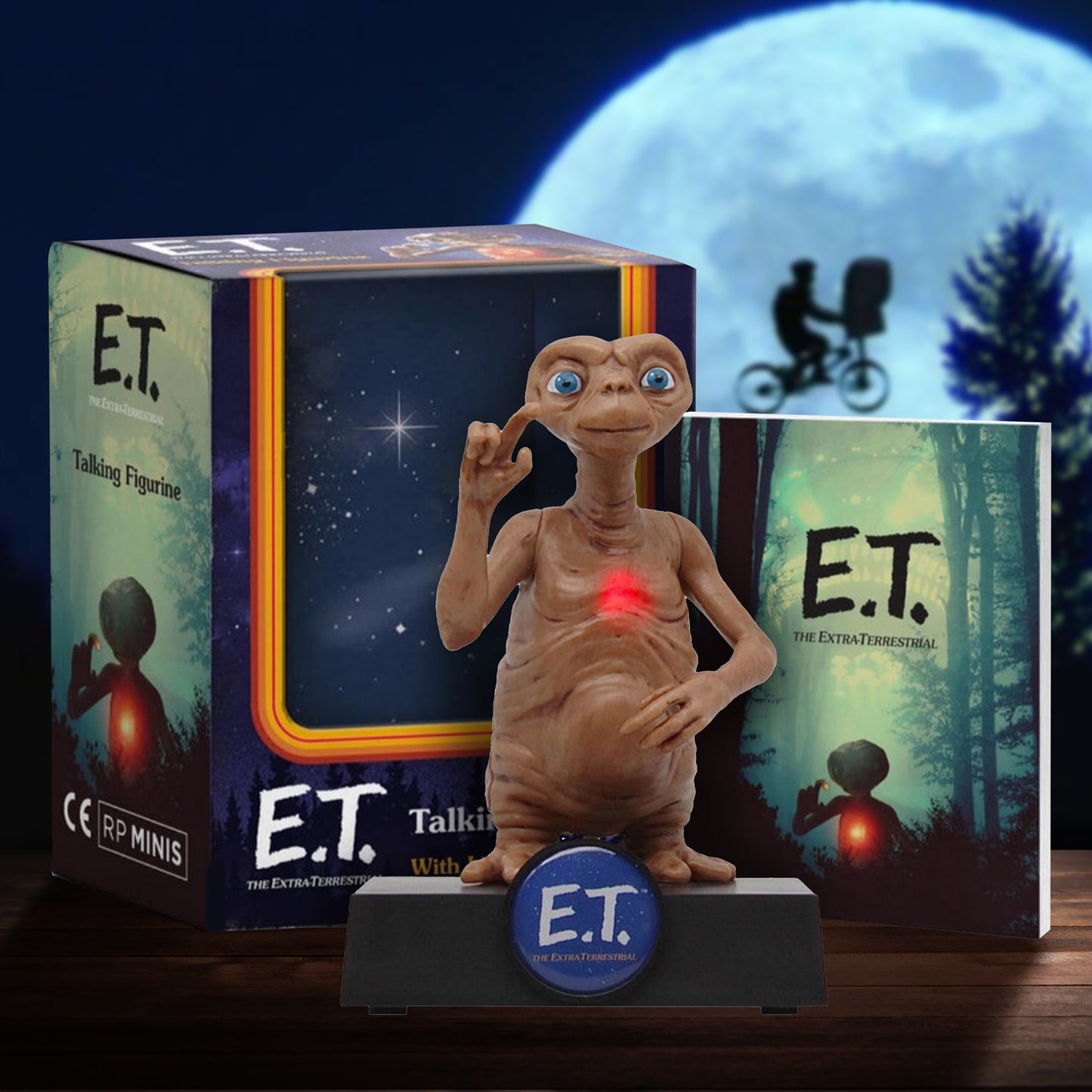 E.T. figurine with packaging and moonlit background