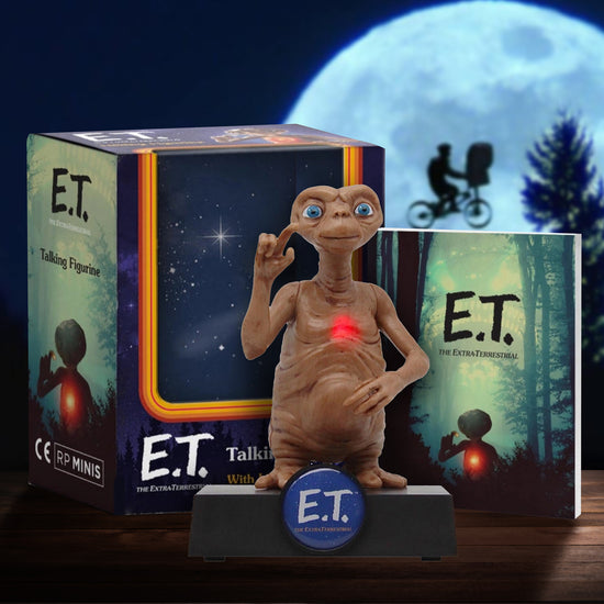 E.T. figurine with packaging and moonlit background