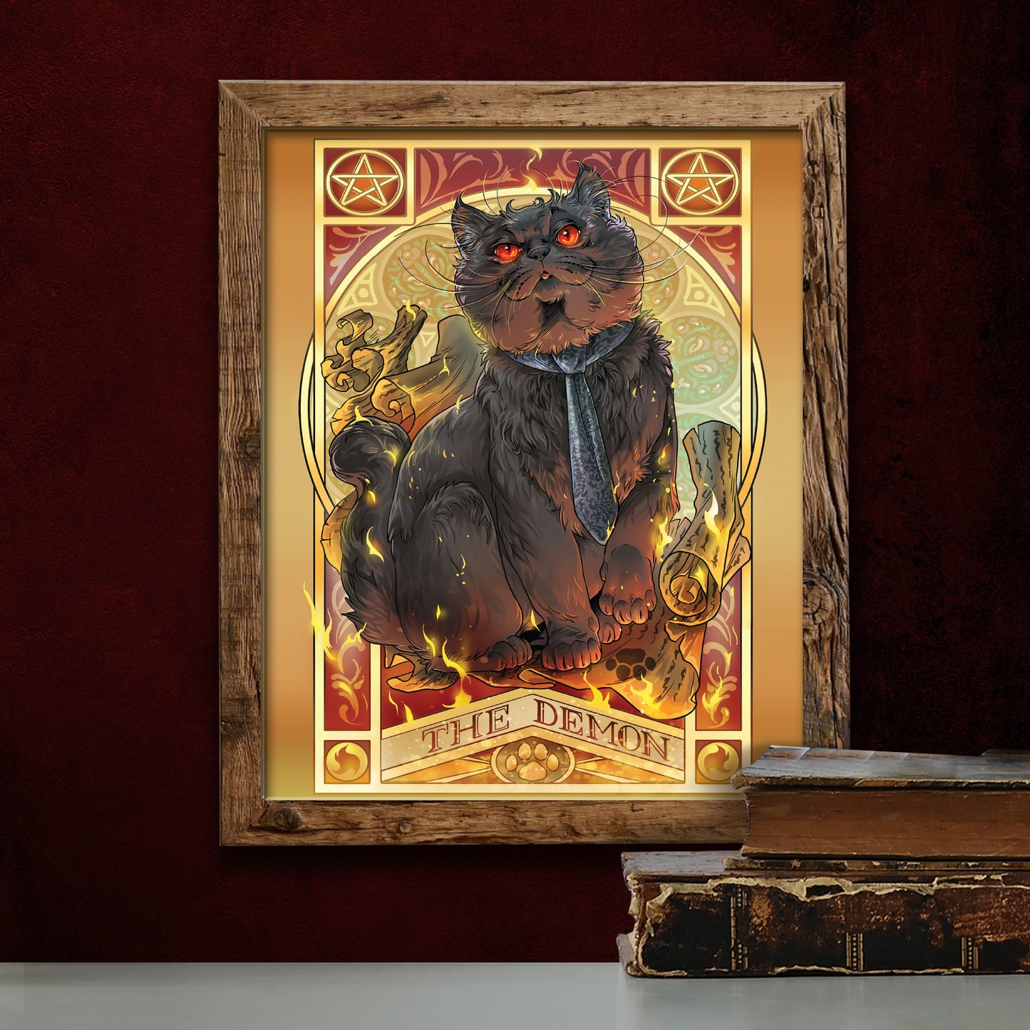 A drawing of a black cat sitting on a scroll, surrounded by flames. At the top corners are pentagrams. Under the cat is yellow text that says "The Demon." The cat is wearing a dark blue tie, and has glowing red eyes. Below the drawing is a stack of old books on a table.