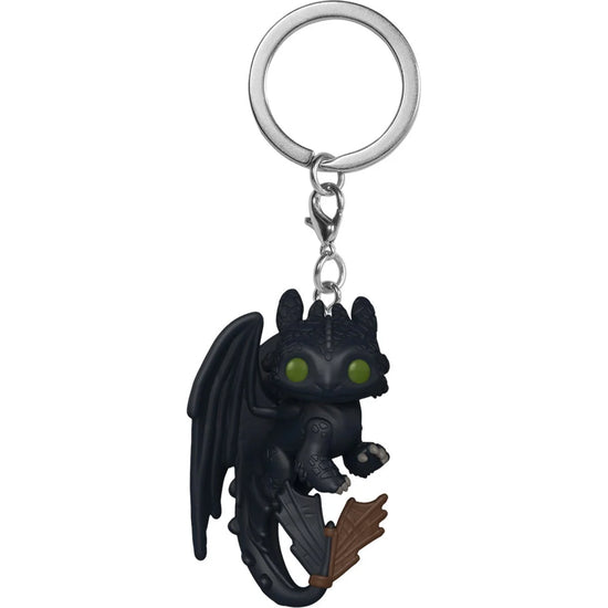A black keychain depicting the dragon Toothless from the live action movie "How to Train Your Dragon." The dragon has dark green eyes and claws, and has a metal key ring on its head.