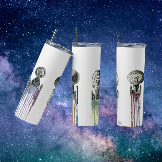 Three white travel mugs, side by side. On the surface of each is an image of a spaceship from Star Trek, with small segments of deep space behind each. At the top of the mug is a stainless steel straw. Behind the mugs is an image of deep space.