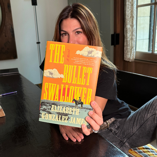 A picture of Gen Padalecki holding up a copy of THE BULLET SWALLOWER by Elizabeth Gonzalez James.