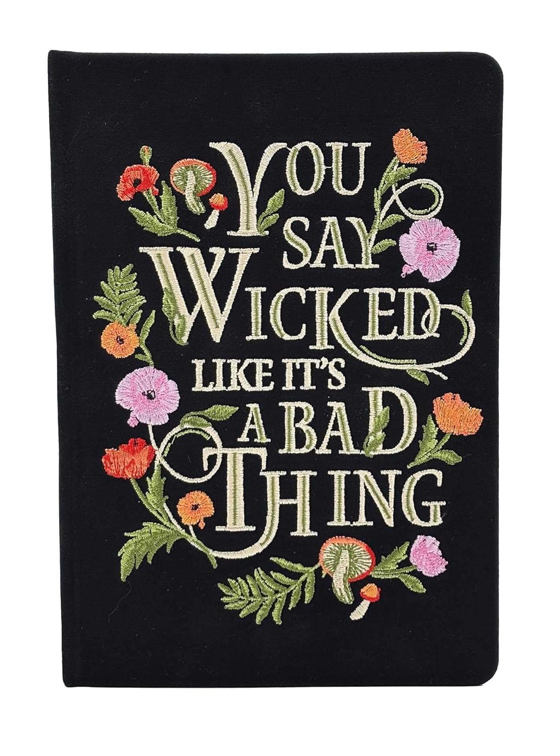 A black embroidered journal with flowers around the borders. White text says "you say wicked like it's a bad thing."