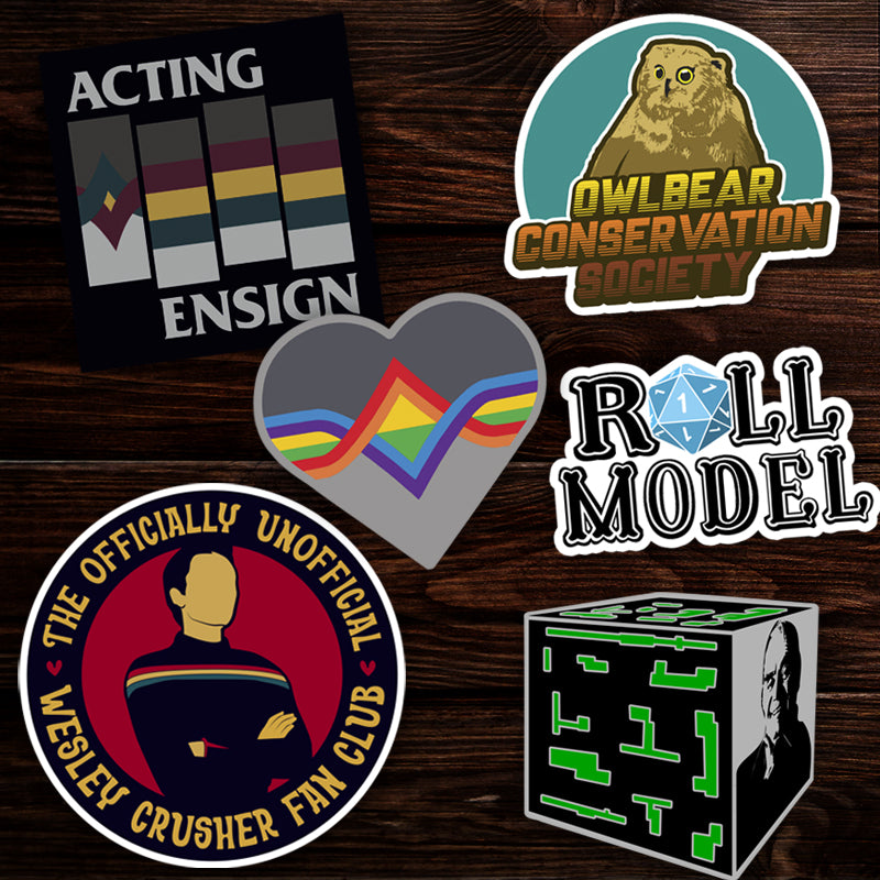 Collection of various stickers on a wooden surface