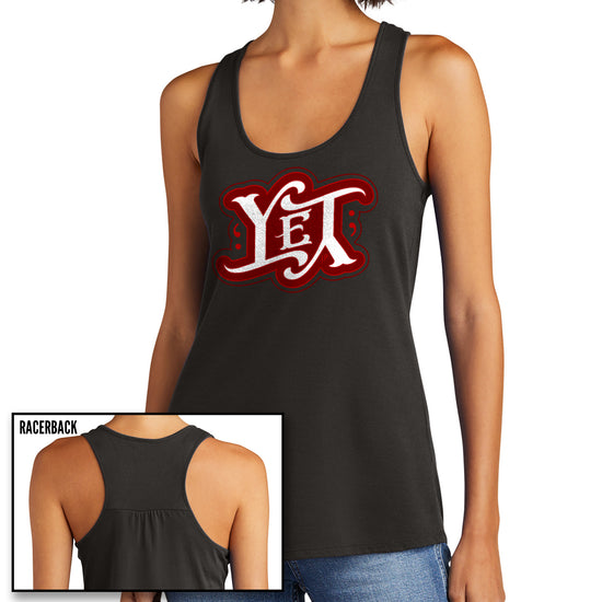 Two images of a female model wearing a dark grey racerback tank top. The front features the word YET in white, outlined in red. The letters are designed to spell the word "yet" right side up and upside down.
