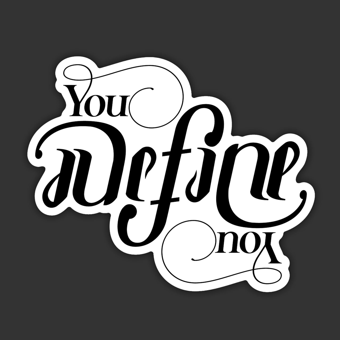 A vinyl sticker depicting the words "You Define You" in black scripted text. The text is designed to be readable rightside up or upside down.
