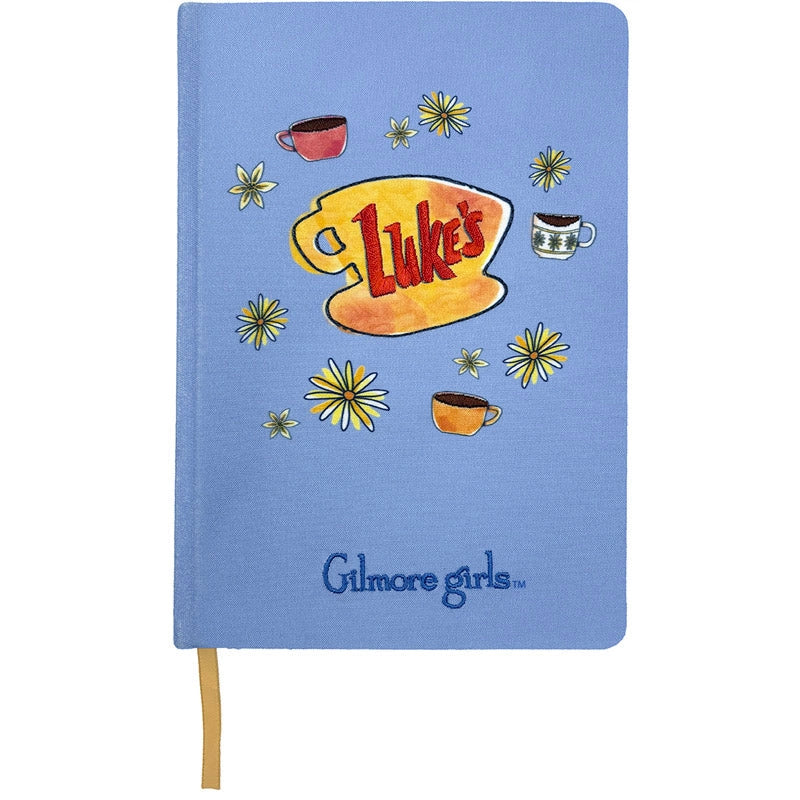 Notebook with 'Gilmore Girls' branding and 'Luke's' logo on a blue background