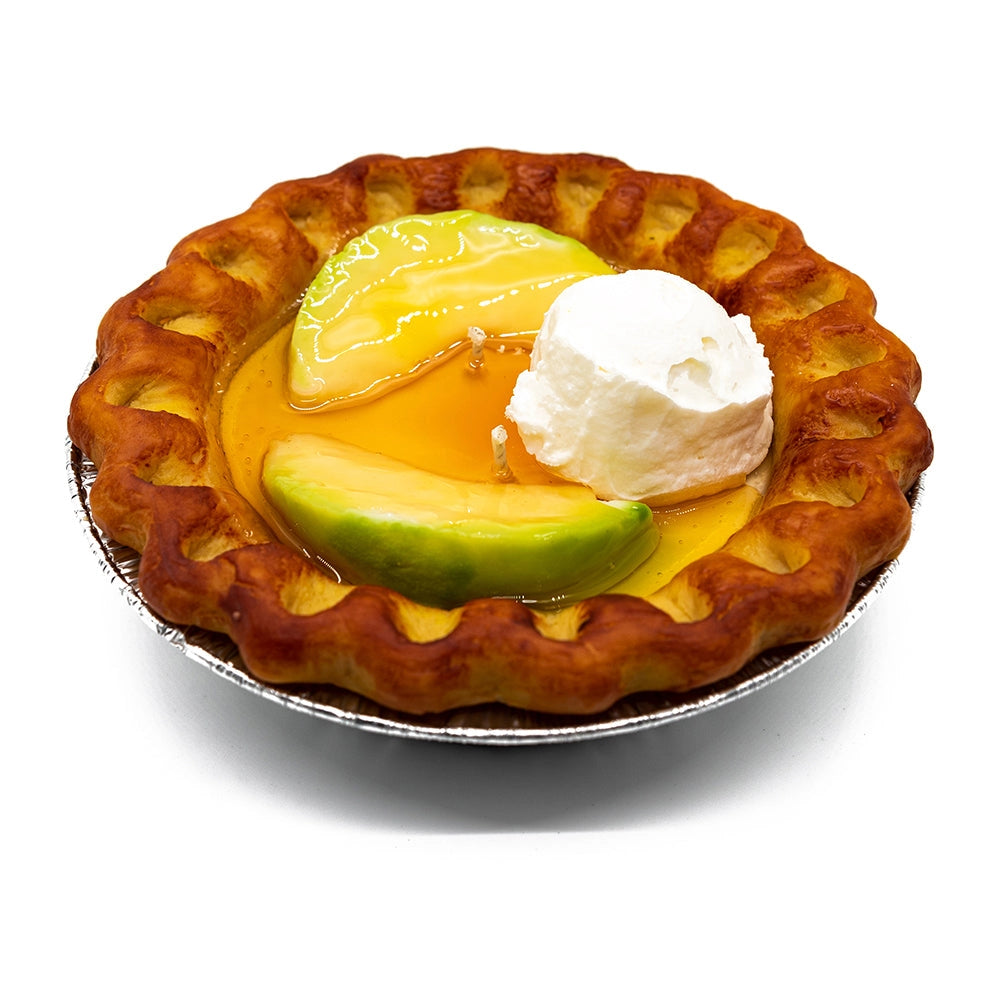 A candle in the shape of an apple pie, complete with 'crust', caramelized 'apple slices' on top, and a dollop of 'ice cream', in a 'pie tin' holder.