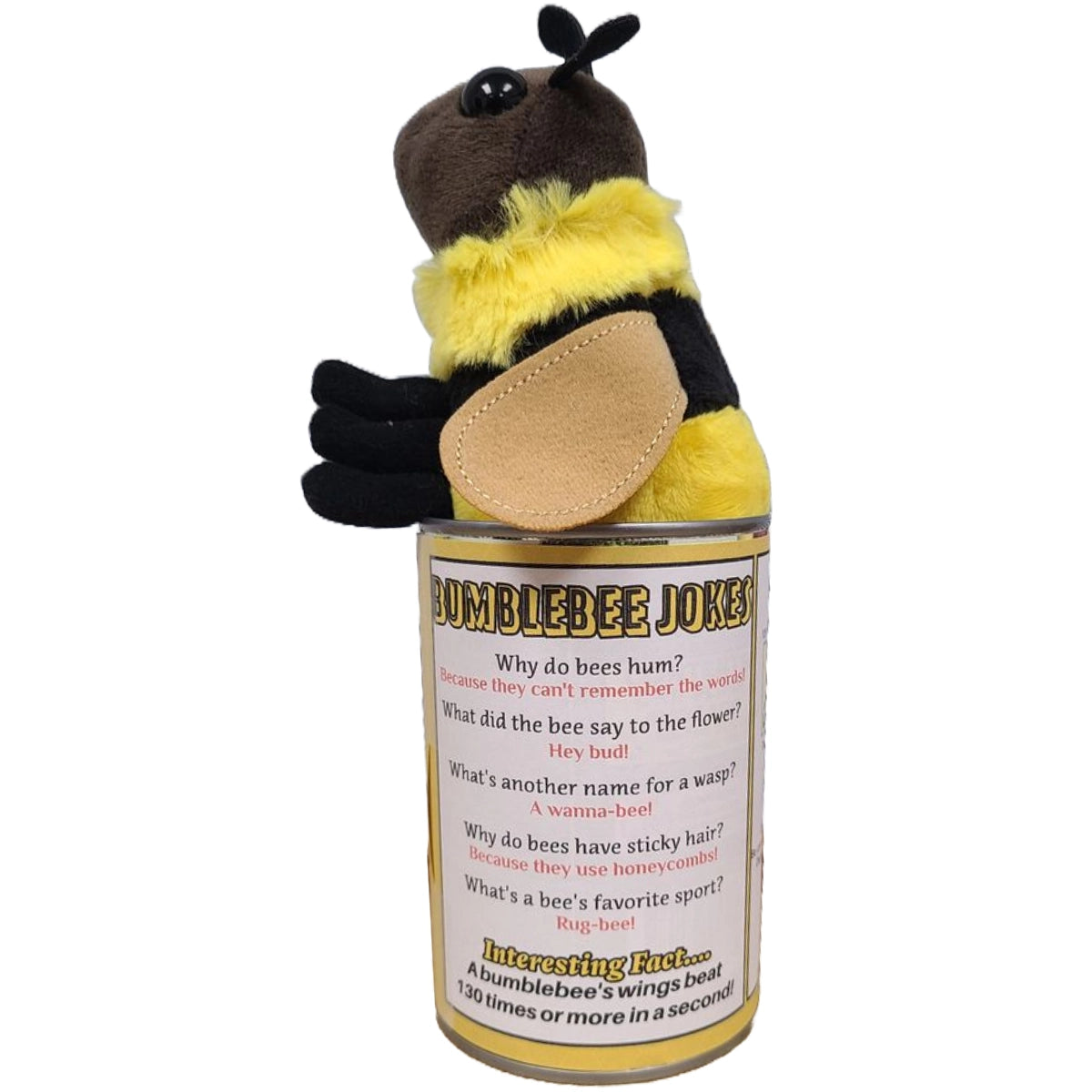 A bumblebee plushie sitting on a yellow can. The back of the can has a white label, with bee-related jokes and facts in black and red text.