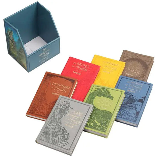 Seven hardcover books in a neat pile, against a white background. Each book is a different color, and focuses on different aspects of Tolkien's Lord of the Rings series. At the top left is a blue container for the books, with "The World of Tolkien" in gold text on the front.