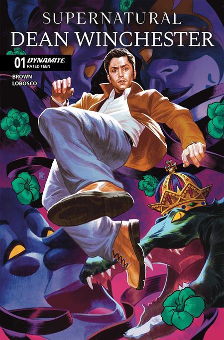Comic book cover for 'Supernatural Dean Winchester' issue 01, featuring a dynamic illustrated scene of Dean Winchester mid-air wearing a brown jacket, white shirt, and light pants, with a green monster and a crown below. The title is at the top, with a 'Dynamite' logo and 'Rated Teen' label on the left.