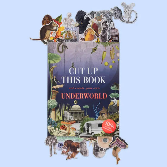 An image of a book on a white background. The background is a dark blue. Across the cover are various images of people, animals, flowers, and buildings. White and red text says "cut up this book and create your own underworld." Above and below the book are random images.