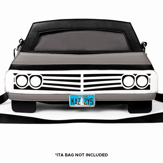 A black handbag shaped like the front view of a 1967 Chevy Impala, against a white background. On the front is a miniature Kansas license plate, reading KAZ 2Y5.