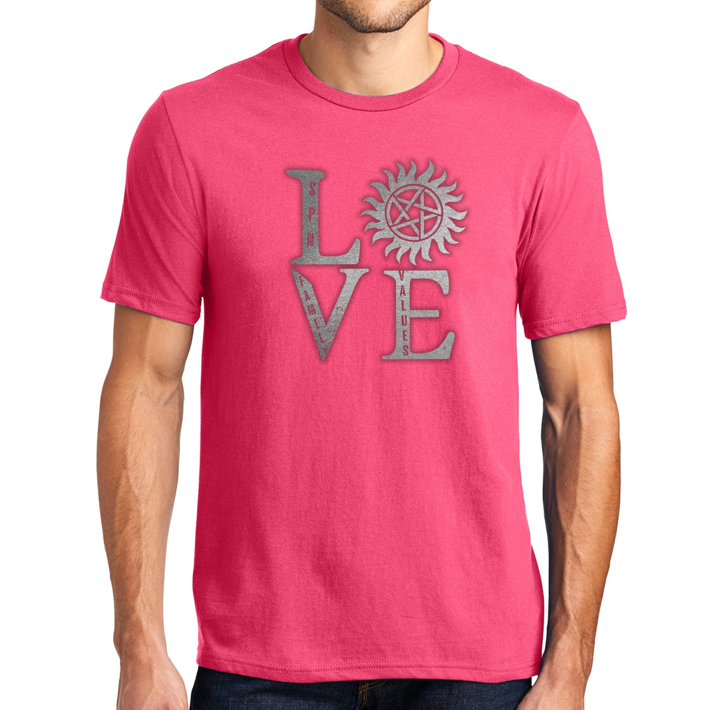 A male model wearing a pink t-shirt, against a white background. The front of the shirt has silver text saying "love," with the "O" replaced by the anti-possession symbol.