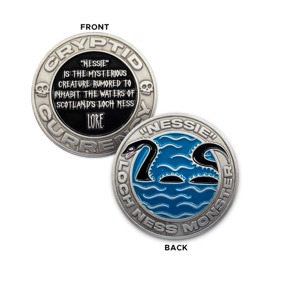 Load image into Gallery viewer, A silver challenge coin. One side features the words &amp;quot;CRYPTID CURRENCY&amp;quot; and two small skulls around the edge, with a black circle containing the words &amp;quot;Nessie is the mysterious creature rumored to inhabit the waters of Scotland&amp;#39;s Loch Ness&amp;quot; and &amp;quot;LORE&amp;quot; in silver. The other side features the words &amp;quot; &amp;#39;NESSIE&amp;#39; &amp;quot; and &amp;quot;LOCH NESS MONSTER&amp;quot; around the edge, with a blue circle containing silver wave lines and a black snake-like illustration of &amp;#39;Nessie&amp;#39;.
