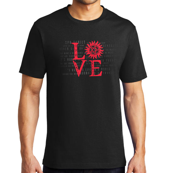 A male model wearing a black unisex t-shirt with red lettering that says LOVE - the "o" is the anti-possession symbol.
