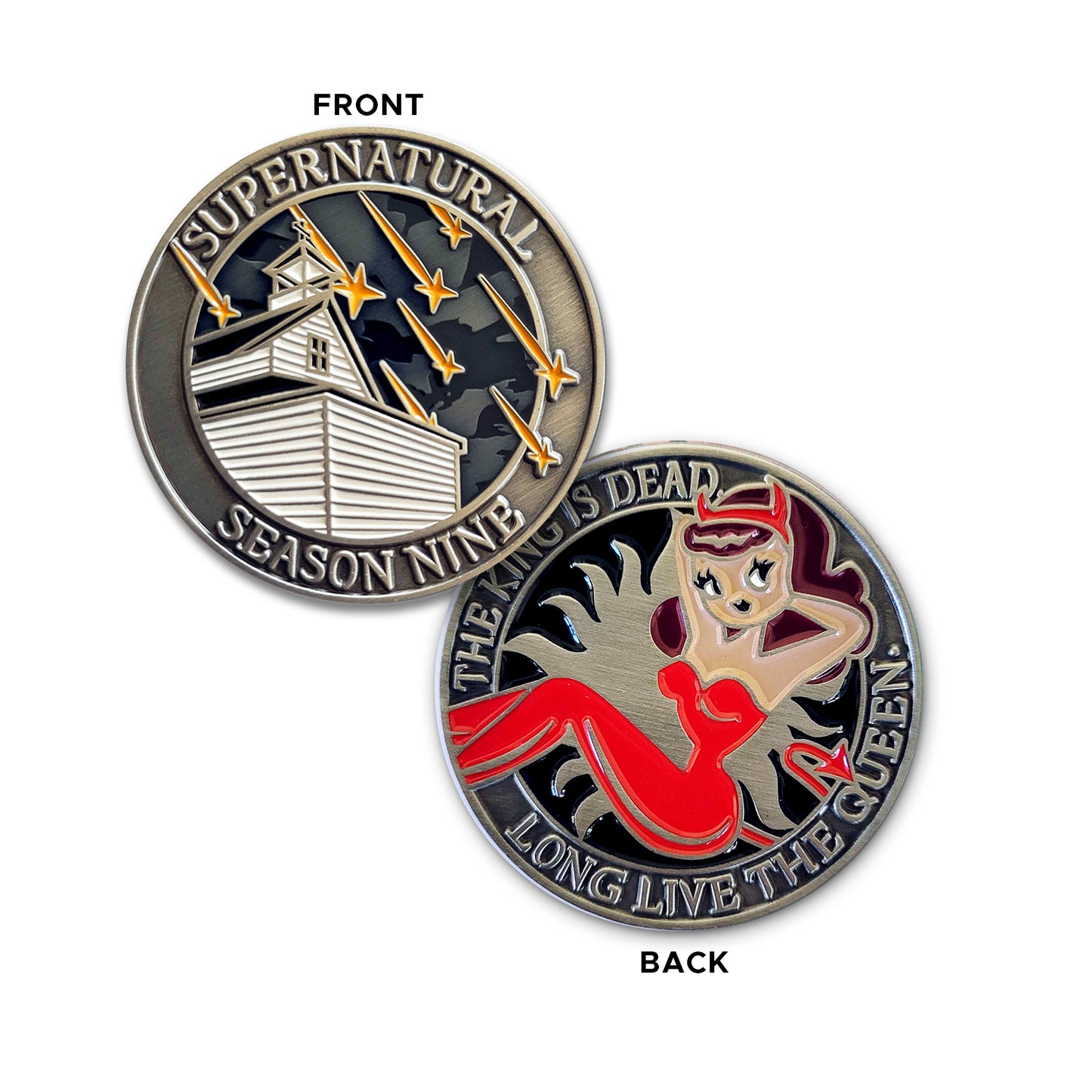 A brass coin charm with "Supernatural season nine", a church with falling stars on one side, and "The king is dead, long live the queen.", and a woman in a red jumpsuit with devil horns and a devil tail  with an anti-possession symbol background on the other.