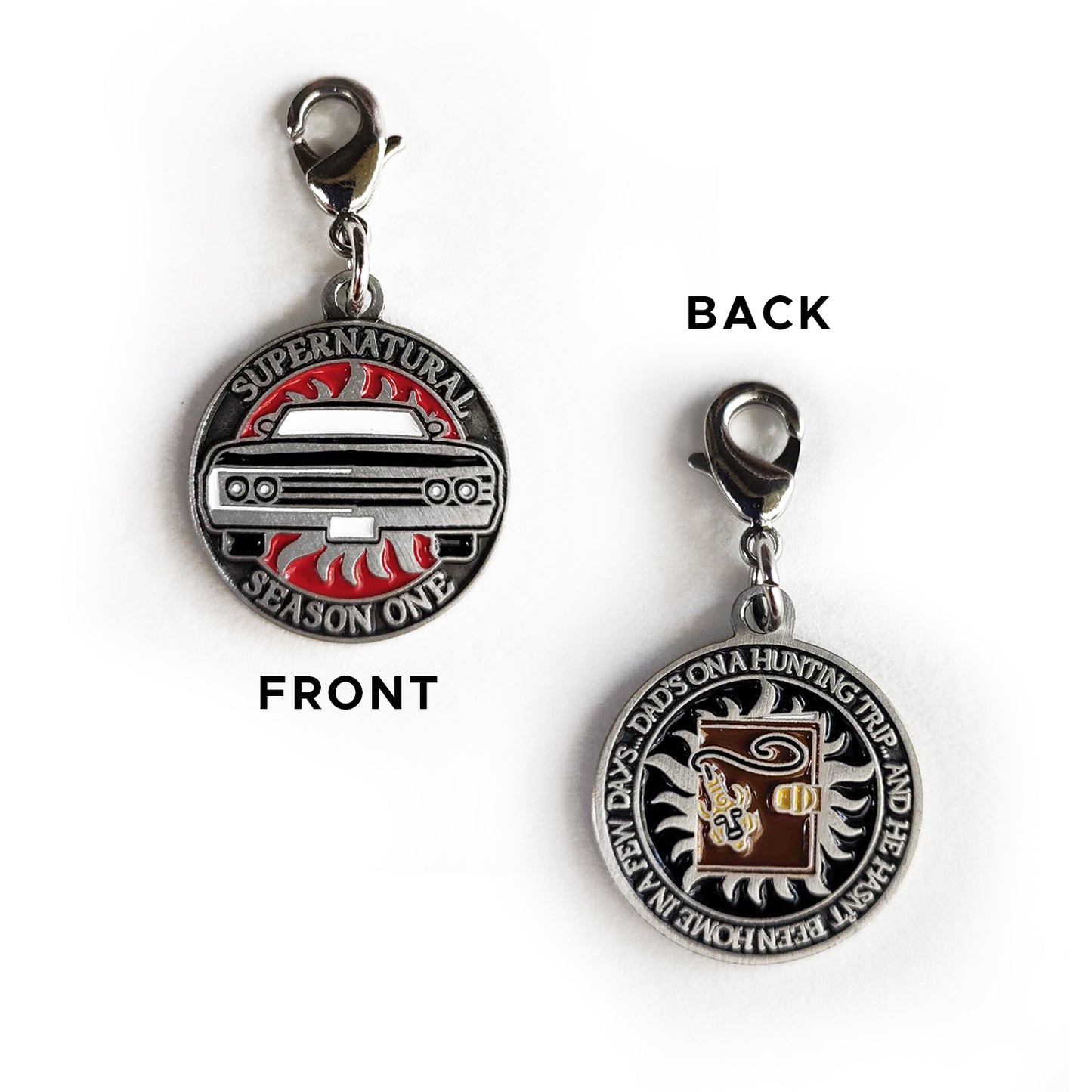 A brass coin charm with "Supernatural season one", a black Impala and an anti-possession symbol on one side and "Dad's on a hunting trip, and he hasn't been back in a few days" with a brown journal and amulet on the other.